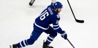 Maple Leafs Trade Rumors: Could Taylor Raddysh Leave Rangers to Join His Brother in Toronto? Taylor Raddysh in a Toronto Maple Leafs home jersey amid NHL trade rumors linking the New York Rangers winger to Toronto.