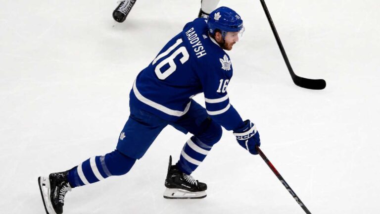 Taylor Raddysh in a Toronto Maple Leafs home jersey amid NHL trade rumors linking the New York Rangers winger to Toronto.