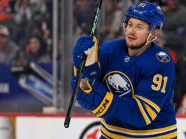 Vladimir Tarasenko wearing a Buffalo Sabres home jersey and helmet amid NHL free agency rumors