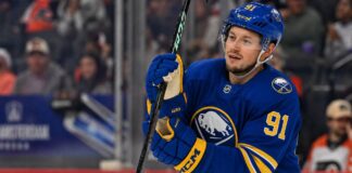 Vladimir Tarasenko wearing a Buffalo Sabres home jersey and helmet amid NHL free agency rumors