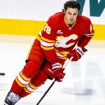 Is Zach Whitecloud on the Trade Block? Calgary Flames Face an Interesting Decision Calgary Flames defenseman Zach Whitecloud skates in a red Flames jersey amid NHL trade rumors linking him to a possible move.
