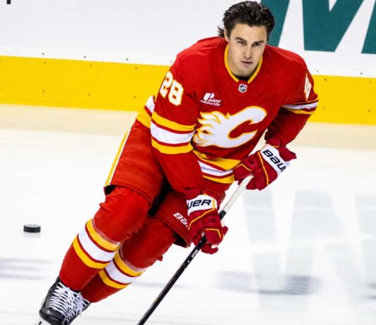 Is Zach Whitecloud on the Trade Block? Calgary Flames Face an Interesting Decision Calgary Flames defenseman Zach Whitecloud skates in a red Flames jersey amid NHL trade rumors linking him to a possible move.