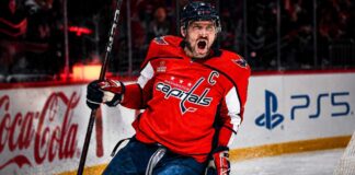 Alex Ovechkin celebrating for the Washington Capitals beside Coca-Cola and PS5 board ads in a 2026-27 fantasy hockey point projection.