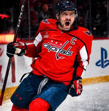 Alex Ovechkin Point Projections 2026-27: Washington Capitals Fantasy Outlook Alex Ovechkin celebrating for the Washington Capitals beside Coca-Cola and PS5 board ads in a 2026-27 fantasy hockey point projection.
