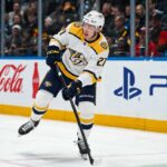 Alexander Nikishin in a Nashville Predators away uniform during game action as Carolina Hurricanes trade rumors link him to Nashville