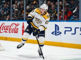 Alexander Nikishin in a Nashville Predators away uniform during game action as Carolina Hurricanes trade rumors link him to Nashville