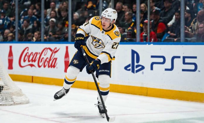 alexander-nikishin-nashville-predators-trade-rumors Alexander Nikishin in a Nashville Predators away uniform during game action as Carolina Hurricanes trade rumors link him to Nashville