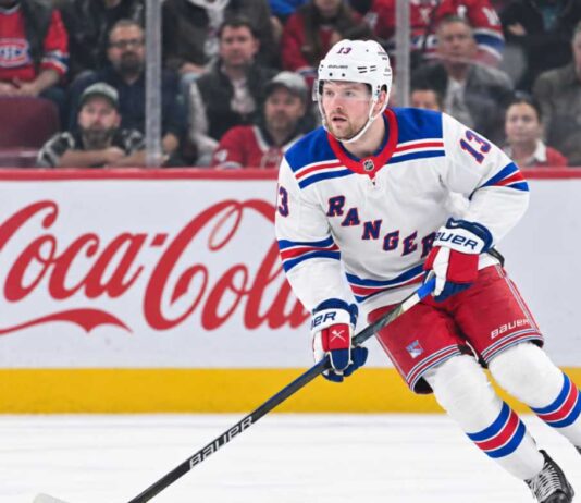 Alexis Lafrenière skating for the New York Rangers as trade rumors surround the young winger ahead of the 2026-27 NHL season.