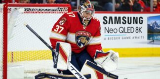 Florida Panthers goalie concept image tied to Connor Hellebuyck trade rumors, showing a goaltender in Florida Panthers gear in the crease with a Samsung TV ad on the boards.