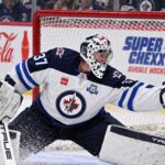 Connor Hellebuyck Trade Rumors: Is a Jets Training Camp Holdout About to Force a Blockbuster? Connor Hellebuyck makes a glove save for the Winnipeg Jets as NHL trade rumors intensify ahead of training camp.