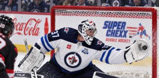 Connor Hellebuyck Trade Rumors: Is a Jets Training Camp Holdout About to Force a Blockbuster? Connor Hellebuyck makes a glove save for the Winnipeg Jets as NHL trade rumors intensify ahead of training camp.