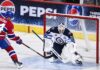 Connor Hellebuyck Trade Rumors: Did His Canadiens Decision Just Open the Door to a Blockbuster? Nick Suzuki of the Montreal Canadiens attacks the net against Winnipeg Jets goalie Connor Hellebuyck amid NHL trade rumors linking Hellebuyck to Montreal.