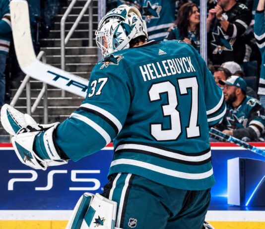 Connor Hellebuyck in a San Jose Sharks uniform amid NHL trade rumors linking the Winnipeg Jets goalie to San Jose.