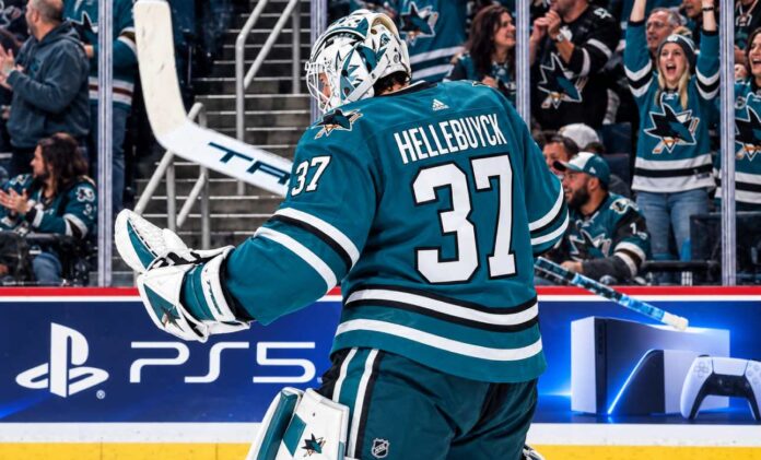connor-hellebuyck-san-jose-sharks-trade-rumors Connor Hellebuyck in a San Jose Sharks uniform amid NHL trade rumors linking the Winnipeg Jets goalie to San Jose.