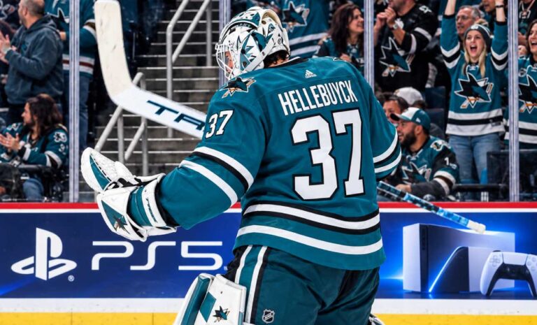Connor Hellebuyck in a San Jose Sharks uniform amid NHL trade rumors linking the Winnipeg Jets goalie to San Jose.
