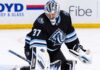 Connor Hellebuyck Trade Rumors: Is His No-Move Clause Quietly Blocking a Utah Mammoth Blockbuster? Connor Hellebuyck in a Utah Mammoth uniform and goalie equipment during warmups, illustrating Winnipeg Jets and Utah Mammoth trade rumors