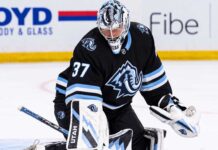 Connor Hellebuyck Trade Rumors: Is His No-Move Clause Quietly Blocking a Utah Mammoth Blockbuster? Connor Hellebuyck in a Utah Mammoth uniform and goalie equipment during warmups, illustrating Winnipeg Jets and Utah Mammoth trade rumors
