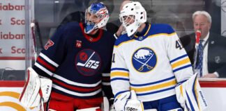 Buffalo Sabres goalie in away uniform beside a Winnipeg Jets goaltender as Connor Hellebuyck trade rumors intensify around the Winnipeg Jets