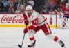 Dylan Larkin of the Detroit Red Wings skates in front of a Montreal Canadiens goalie during NHL trade rumors linking Larkin to Montreal
