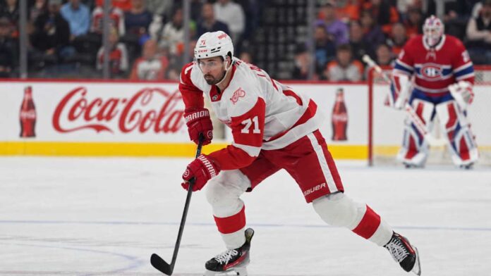 dylan-larkin-canadiens-red-wings-trade-rumors Dylan Larkin of the Detroit Red Wings skates in front of a Montreal Canadiens goalie during NHL trade rumors linking Larkin to Montreal