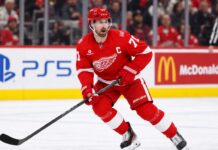 Detroit Red Wings captain Dylan Larkin skating during game action as Dylan Larkin trade rumors continue to swirl around the Detroit Red Wings
