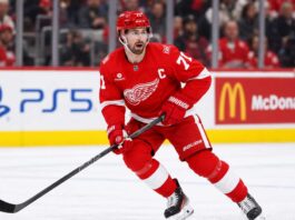 Detroit Red Wings captain Dylan Larkin skating during game action as Dylan Larkin trade rumors continue to swirl around the Detroit Red Wings