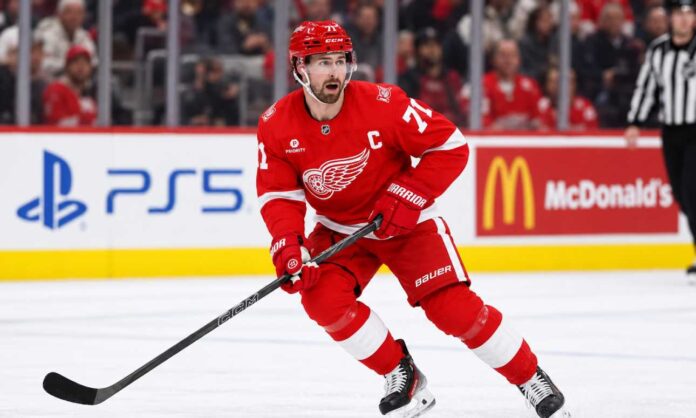 dylan-larkin-detroit-red-wings-trade-rumors-2026 Detroit Red Wings captain Dylan Larkin skating during game action as Dylan Larkin trade rumors continue to swirl around the Detroit Red Wings