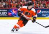 Dylan Larkin in a Philadelphia Flyers home jersey amid NHL trade rumors linking the Detroit Red Wings center to Philadelphia.