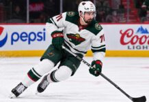 Dylan Larkin Trade Rumors: Did Detroit’s GM Change Reopen the Door for the Wild? Dylan Larkin in a Minnesota Wild away uniform concept image amid NHL trade rumors linking the Detroit Red Wings centre to Minnesota.