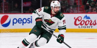 Dylan Larkin Trade Rumors: Did Detroit’s GM Change Reopen the Door for the Wild? Dylan Larkin in a Minnesota Wild away uniform concept image amid NHL trade rumors linking the Detroit Red Wings centre to Minnesota.