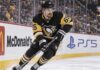 Erik Karlsson of the Pittsburgh Penguins skates along the boards during game action, highlighting his 2026-27 fantasy hockey outlook