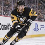 Erik Karlsson Fantasy Hockey Prediction: Can He Reach 70 Points Again in 2026-27? Erik Karlsson of the Pittsburgh Penguins skates along the boards during game action, highlighting his 2026-27 fantasy hockey outlook