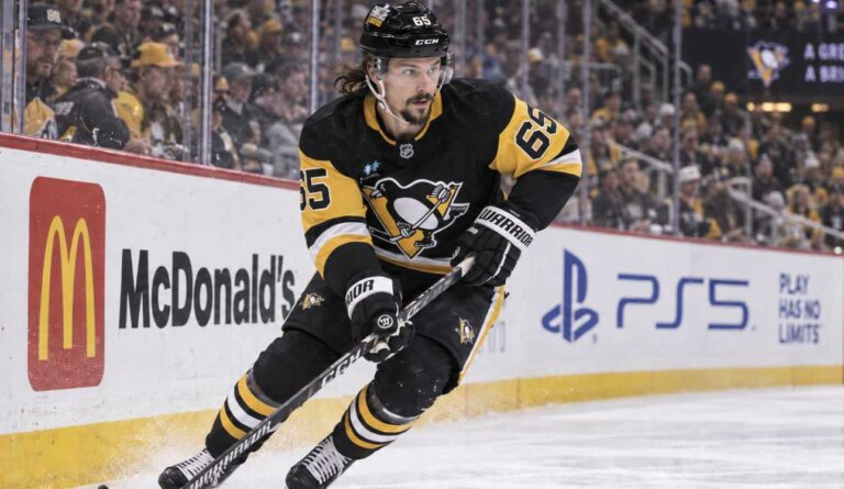 Erik Karlsson of the Pittsburgh Penguins skates along the boards during game action, highlighting his 2026-27 fantasy hockey outlook