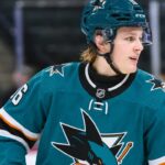 Ivar Stenberg Fantasy Hockey Prediction: How High Can the Sharks Rookie Climb in 2026-27? Ivar Stenberg wearing a San Jose Sharks home jersey and helmet in an action-style image for a 2026-27 fantasy hockey prediction