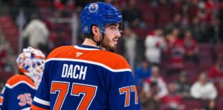 Edmonton Oilers Trade Rumors: Could Kirby Dach Be Montreal’s Next Trade Domino? Kirby Dach in an Edmonton Oilers home jersey amid NHL trade rumors linking the Oilers and Montreal Canadiens.