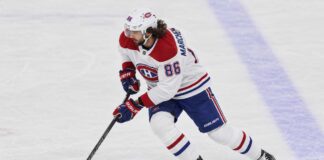 Kirill Marchenko Trade Rumors: Did His Latest Comments Reopen the Canadiens Door? Kirill Marchenko in a Montreal Canadiens uniform skates with the puck in a concept image illustrating Montreal Canadiens trade rumors involving the Columbus Blue Jackets winger.