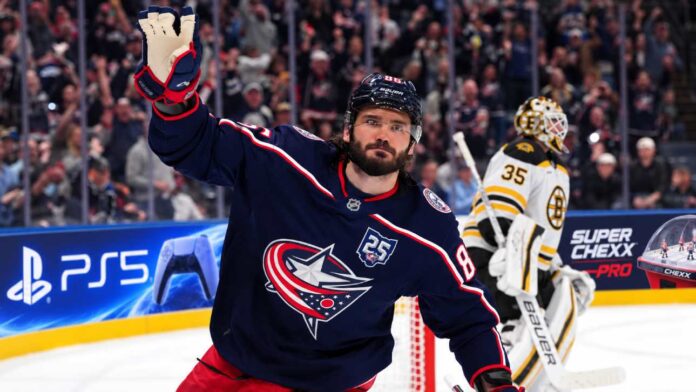 kirill-marchenko-montreal-canadiens-boston-bruins-trade-rumors Kirill Marchenko of the Columbus Blue Jackets with a Boston Bruins goalie in the background amid Montreal Canadiens trade rumors