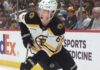 Mason Lohrei Trade Rumors: Why the Boston Bruins Could Listen Before Training Camp Boston Bruins defenseman skating with the puck during NHL game action as Boston Bruins trade rumors heat up before training camp