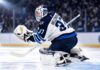 NHL News Today: Hellebuyck Trade Market Heats Up as Maple Leafs Add Brisson Connor Hellebuyck in Winnipeg Jets gear making a save during a game as NHL trade rumors and today’s NHL News spotlight his future