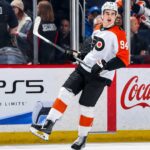 Porter Martone Fantasy Hockey Projection: Can He Reach 70 Points? Porter Martone Philadelphia Flyers 2026-27 fantasy hockey projection with PS5 and Coca-Cola rink board ads