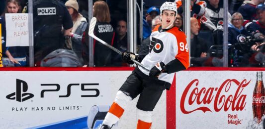 Porter Martone Fantasy Hockey Projection: Can He Reach 70 Points? Porter Martone Philadelphia Flyers 2026-27 fantasy hockey projection with PS5 and Coca-Cola rink board ads