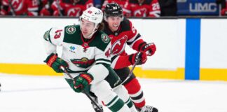 Quinn Hughes Trade Rumors: Did Minnesota’s Final Eight-Year Deadline Reopen the Door for the Devils? Quinn Hughes of the Minnesota Wild skates with the puck as a New Jersey Devils player pressures him during NHL action amid Quinn Hughes trade rumors