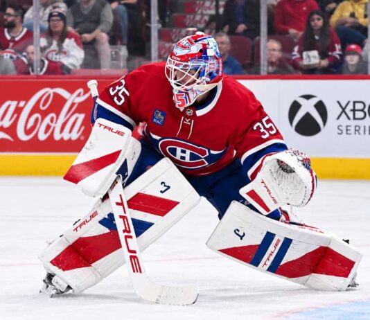 Samuel Montembeault of the Montreal Canadiens in a ready stance during preseason action as trade rumors build around the Canadiens goaltender.