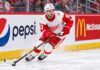 Alex DeBrincat Trade Rumors: Is Detroit’s Chaos About to Put Another Star in Play? Alex DeBrincat skating for the Detroit Red Wings as NHL trade rumors grow around his contract future in Detroit.