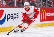 Alex DeBrincat Trade Rumors: Is Detroit’s Chaos About to Put Another Star in Play? Alex DeBrincat skating for the Detroit Red Wings as NHL trade rumors grow around his contract future in Detroit.