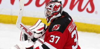 NHL News Today: Hellebuyck Trade, NHL Rumors and Scores — October 24, 2026 Connor Hellebuyck wearing a New Jersey Devils home jersey, red and black goalie equipment and Devils-themed mask in an edited image illustrating his blockbuster trade from the Winnipeg Jets in October 2026.