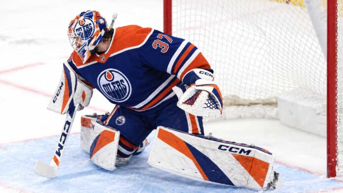 connor-hellebuyck-edmonton-oilers-trade-rumors Connor Hellebuyck wearing Edmonton Oilers goalie gear amid NHL trade rumors linking the Winnipeg Jets star to Edmonton.
