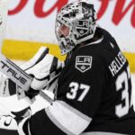 Connor Hellebuyck to the Kings? Winnipeg Jets Face a Trade Decision That Could Change Everything Connor Hellebuyck wearing a Los Angeles Kings jersey and goalie equipment in a conceptual image illustrating NHL trade rumors linking the Winnipeg Jets star goaltender to Los Angeles.
