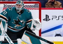 Connor Hellebuyck Would Consider the Sharks: So Why Hasn’t Winnipeg Made the Trade? Connor Hellebuyck in a San Jose Sharks uniform amid NHL trade rumors linking the Winnipeg Jets goalie to San Jose