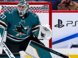 Connor Hellebuyck in a San Jose Sharks uniform amid NHL trade rumors linking the Winnipeg Jets goalie to San Jose